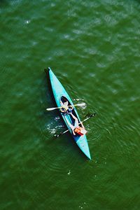 High angle view of people canoeing in lake