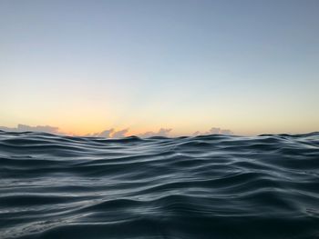 Scenic view of sea against clear sky during sunset