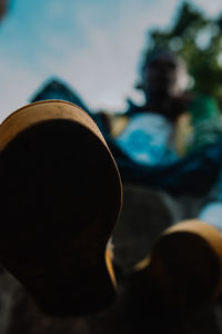 Low angle view of hat on metal