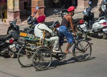 Bicycles parked on road in city