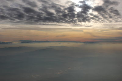 View of calm sea against cloudy sky