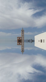 Low angle view of airplane flying against sky