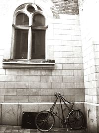 Low angle view of bicycle against building