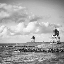 Scenic view of sea against cloudy sky