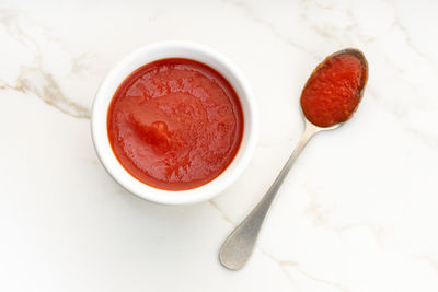 High angle view of red tea on table