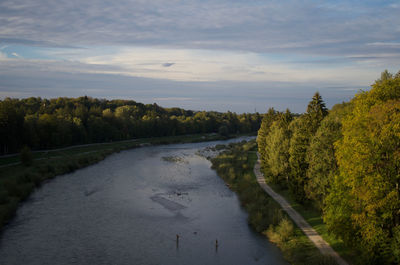 Scenic view of river amidst trees against sky