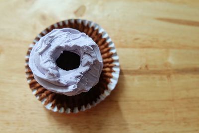 High angle view of cupcakes on wooden table