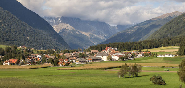 High angle view of village amongst mountain