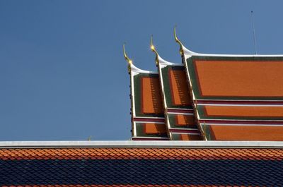 Low angle view of illuminated building against sky