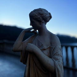 Low angle view of statue against sky