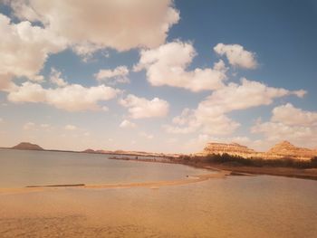 Scenic view of beach against sky