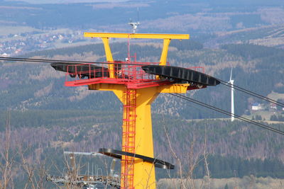 View of cranes against sky