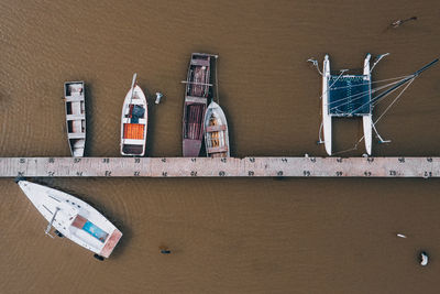 Aerial view of boats docked at jetty