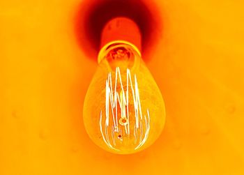 Close-up of illuminated light bulb