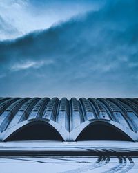 Low angle view of building against sky during winter