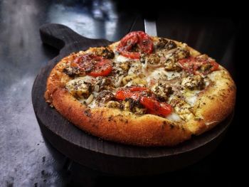 Close-up of pizza on cutting board