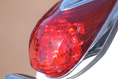 Close-up of a red glass against white background