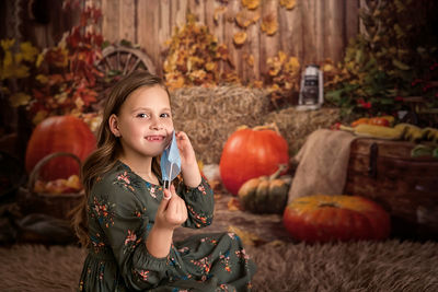 Portrait of cute girl sitting on sofa