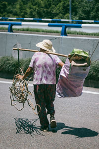 Rear view of woman with umbrella