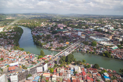 High angle view of river amidst buildings in city