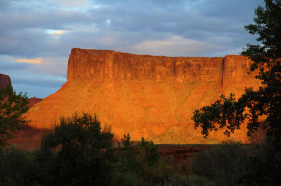 View of rock formations against cloudy sky