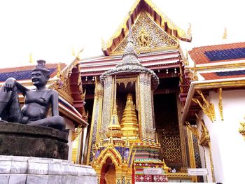 Low angle view of statue against building