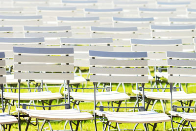 Full frame shot of empty chairs arranged in row