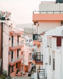 Residential buildings against sky in city