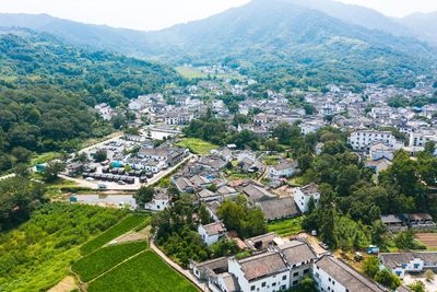 High angle view of townscape and mountains