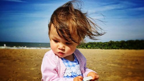 Portrait of a girl standing on beach