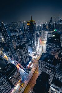 High angle view of city lit up at night