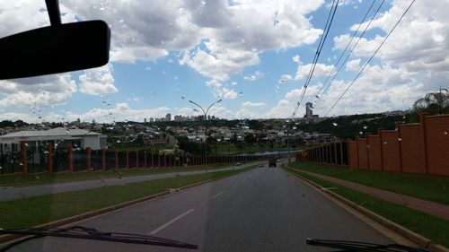 View of road against cloudy sky