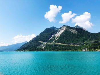 Scenic view of sea against blue sky