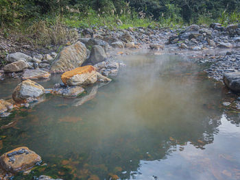 Aerial view of rocks in lake