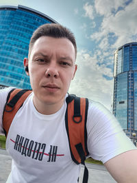 Portrait of young man standing outdoors