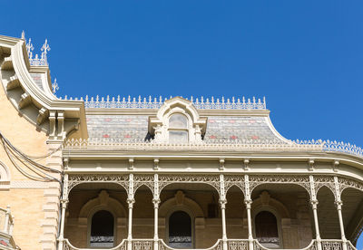 Low angle view of historical building against blue sky