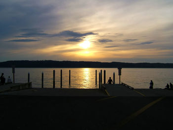 Scenic view of river at sunset