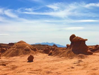 Rock formations in desert against sky