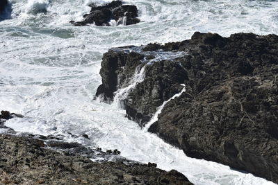 Sea waves splashing on rocks