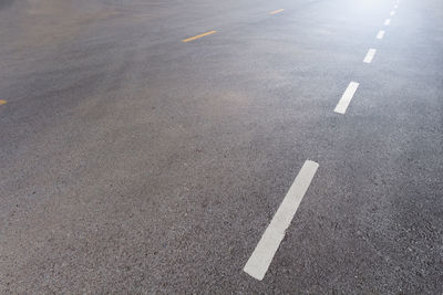 High angle view of arrow sign on road