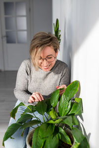 Portrait of smiling young woman at home