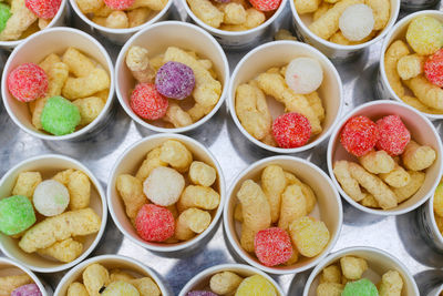 Top view of ice cream cups with colorful cakes in the market in vietnam