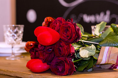 Close-up of red roses in vase on table