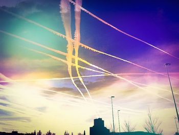 Low angle view of power lines against blue sky