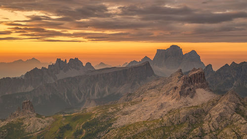 Scenic view of rocky mountains against sky during sunset