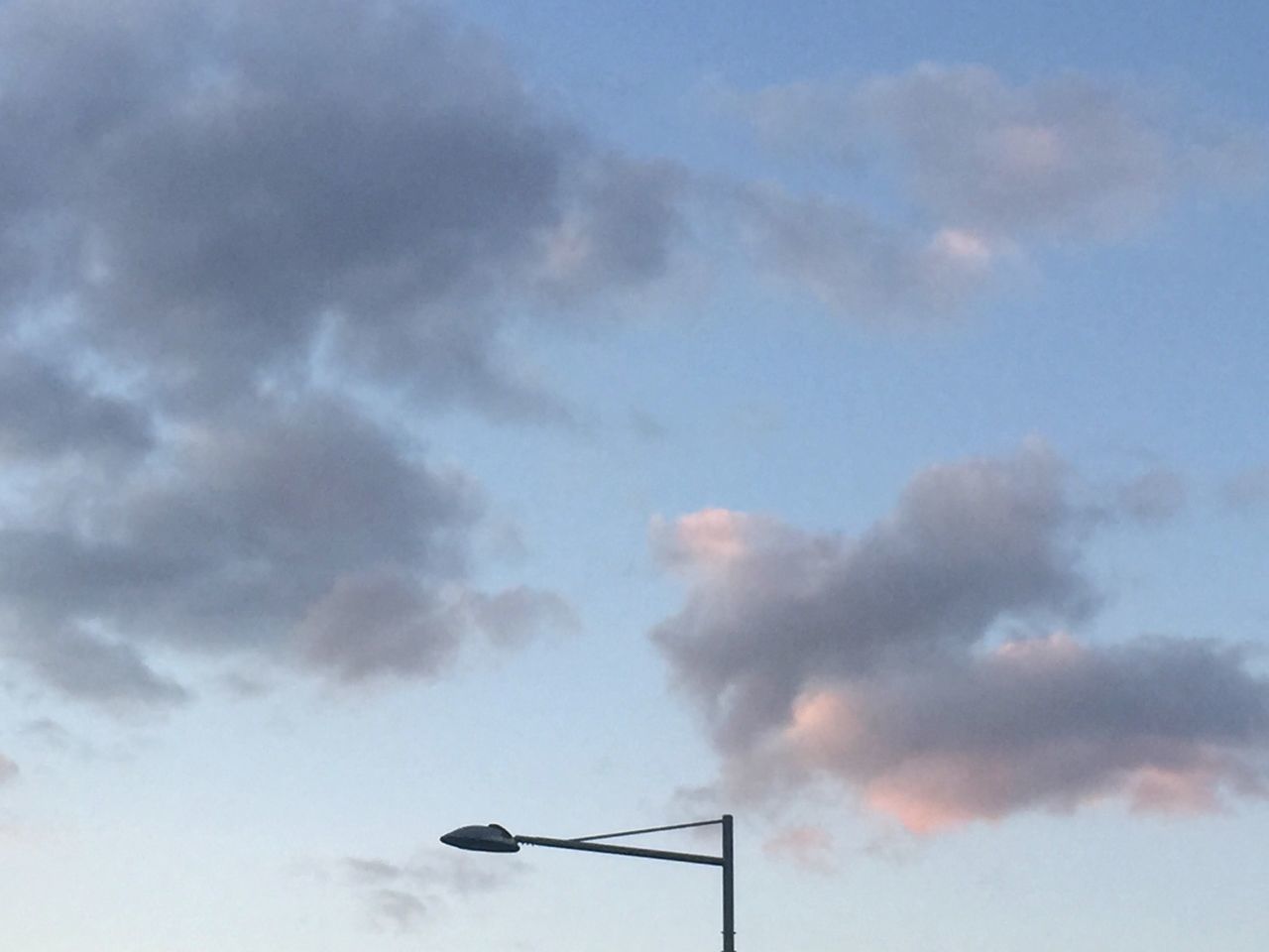 LOW ANGLE VIEW OF STREET LIGHTS AGAINST SKY