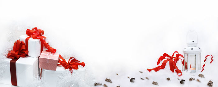 Close-up of christmas decorations over white background