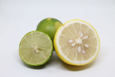 Close-up of lemon slice against white background