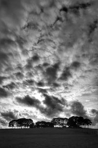 Scenic view of storm clouds over landscape against sky