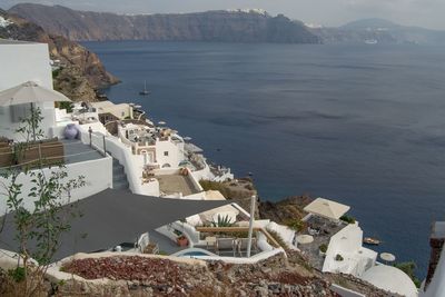 High angle view of townscape by sea